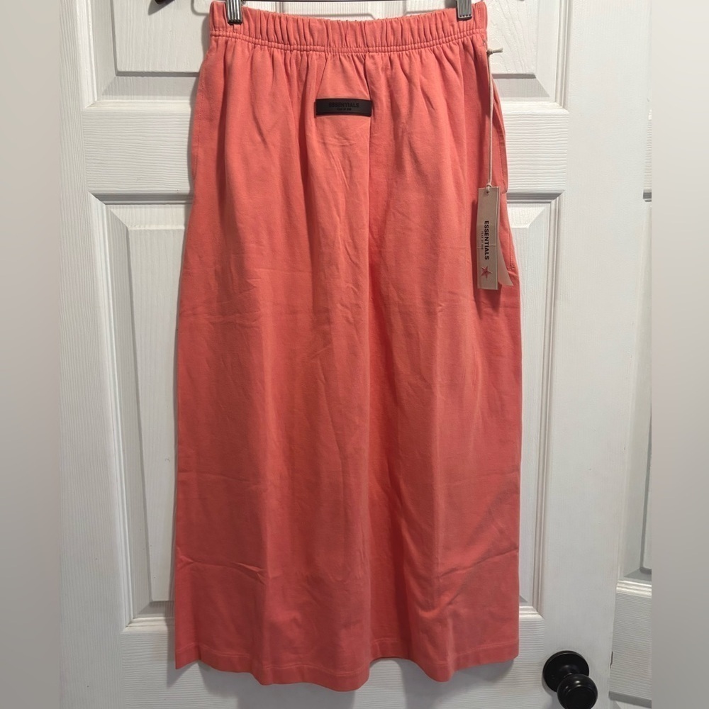 NWT FOG Essentials Fear of God Women's
Jersey Long Skirt Coral Small BRAND NEW